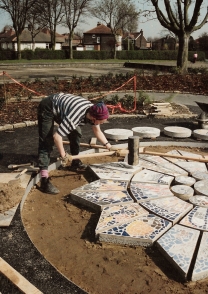 Installing Public Art Mosaic in Davyhulme Park, Urmston, Manchester 1992, for Chryslais Arts.